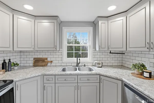 a kitchen with sink and window