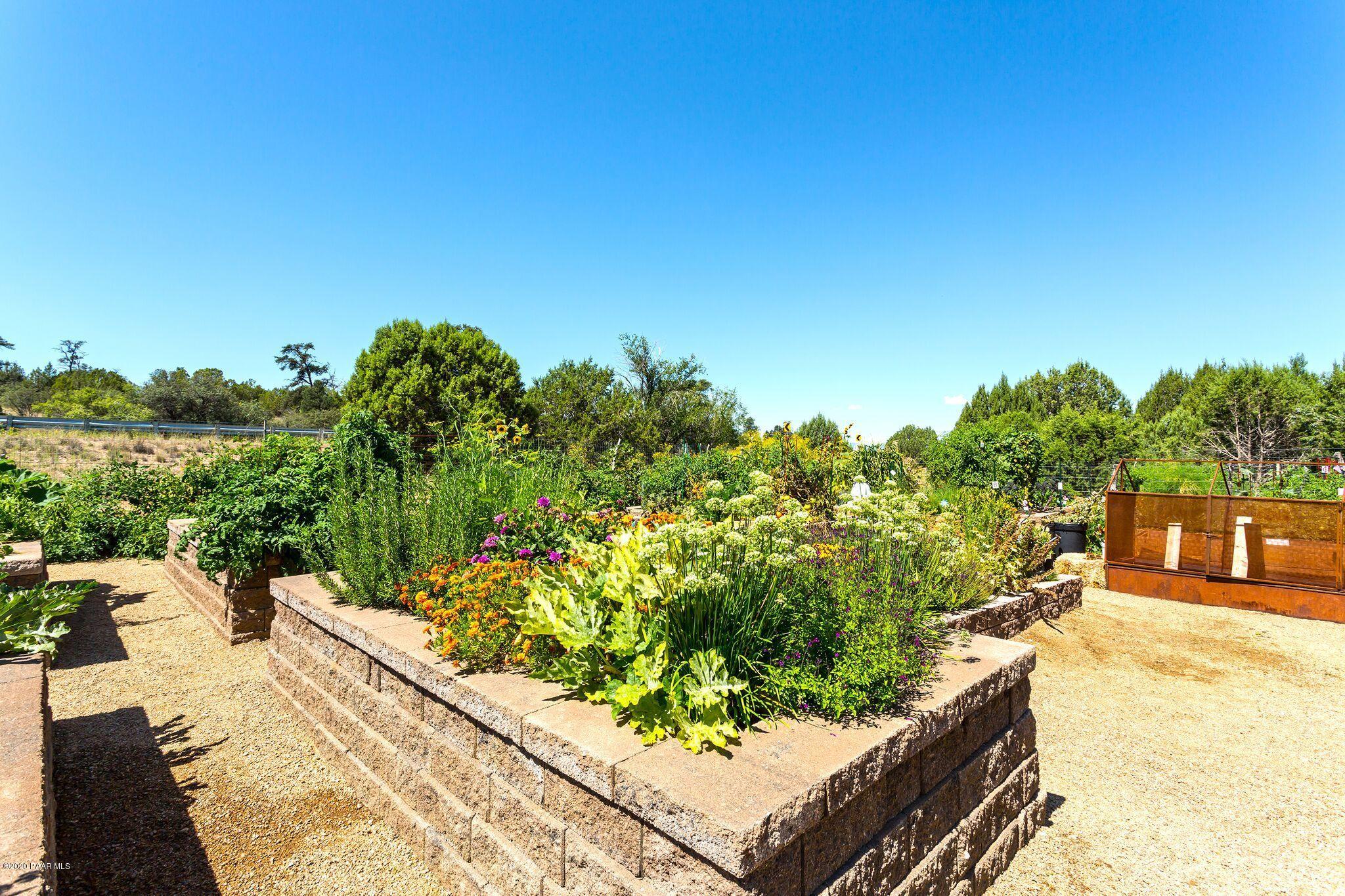 4930 West Sterling Ranch Road Prescott, AZ 86305 - Photo 22 of 22 a view of a garden with an outdoor seating