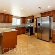 a kitchen with stainless steel appliances a sink and a stove top oven