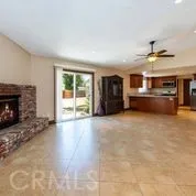 a kitchen with granite countertop a refrigerator and a sink