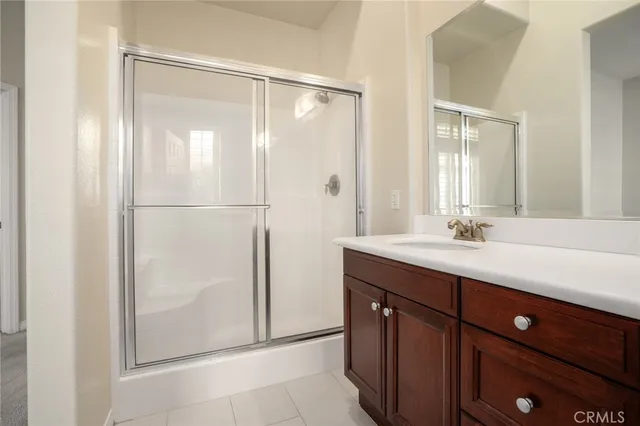 a bathroom with a double vanity sink and mirror