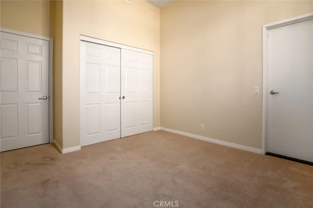 an empty room with closet area