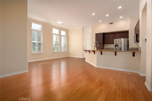 a view of a kitchen with a sink and a window