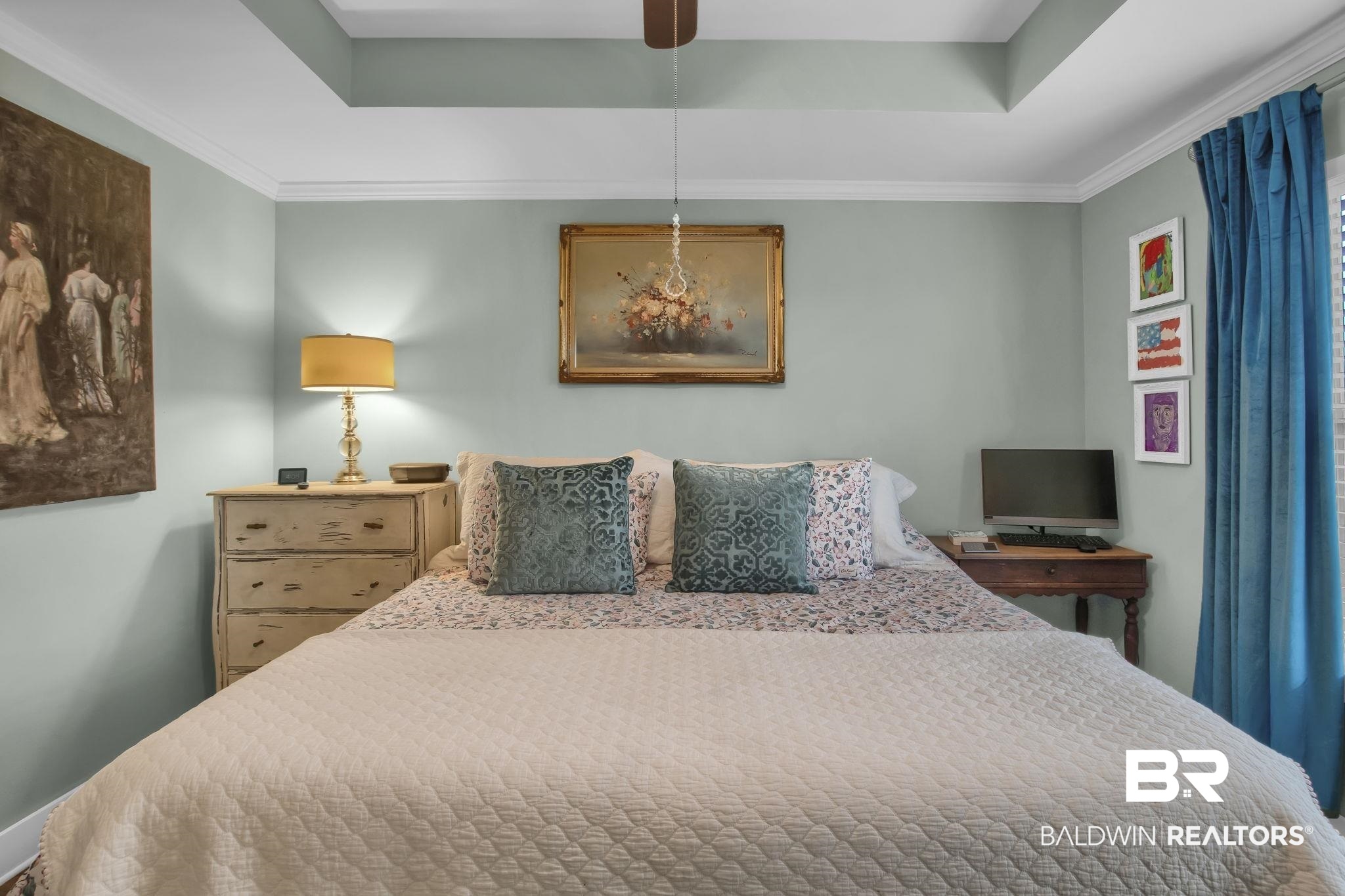 203 Lakefront Circle Summerdale, AL 36580 - Photo 35 of 69 Bedroom with crown molding, a tray ceiling, and ceiling fan