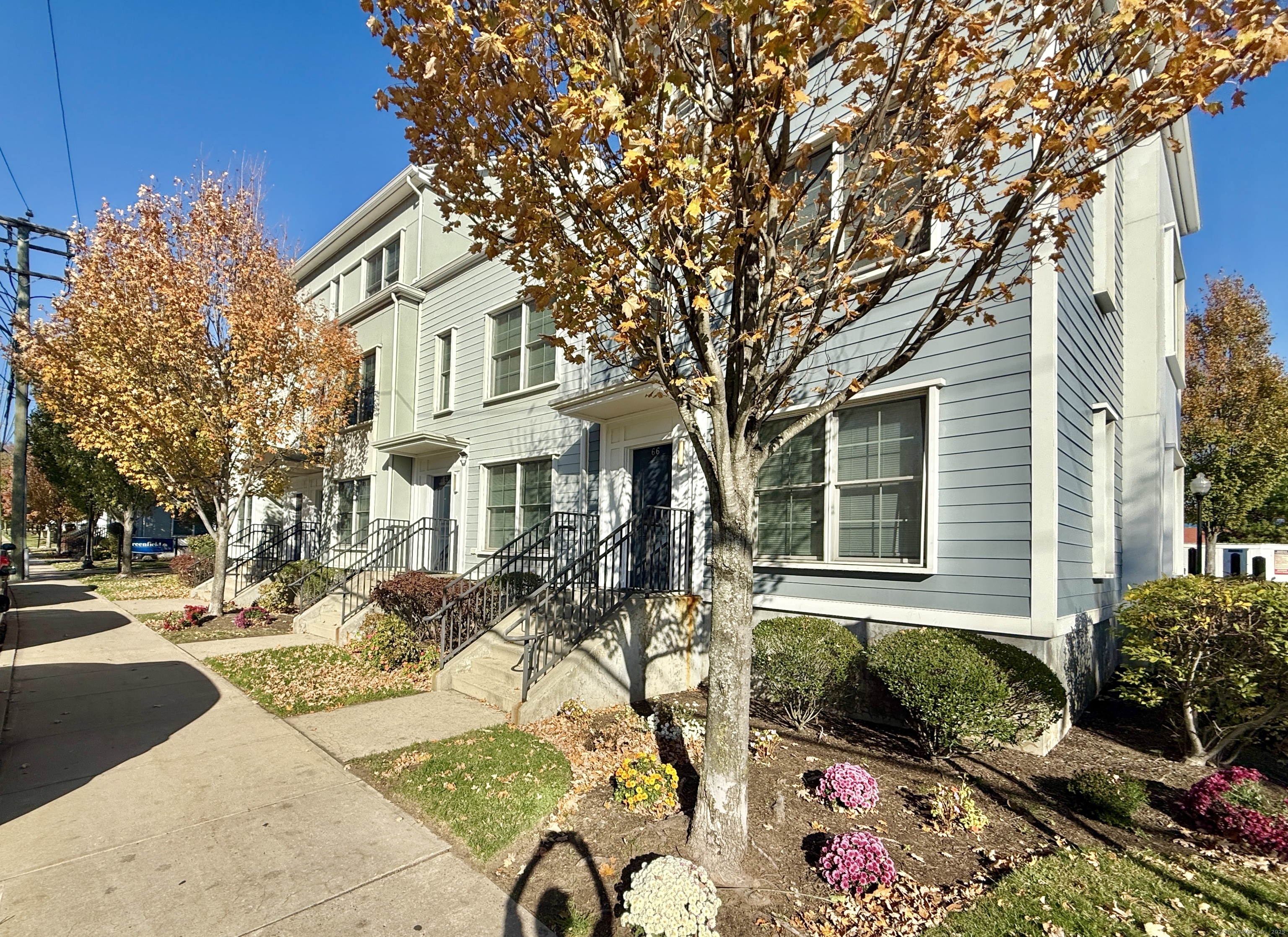 64 Merrell Avenue, Unit 64 Stamford, CT 06902 - Photo 1 of 1 a front view of a house with outdoor space