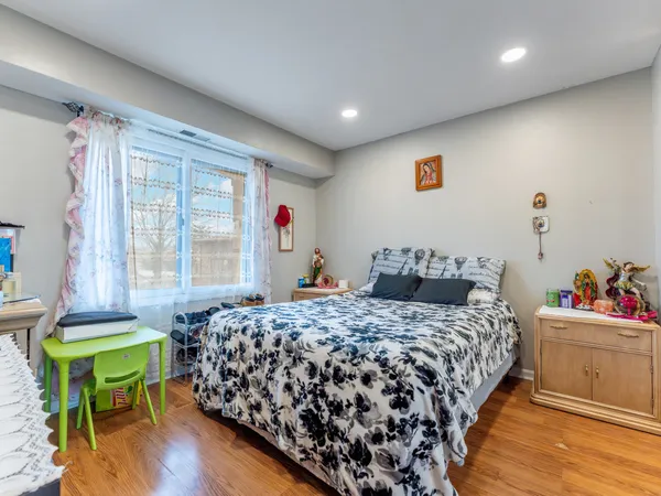 a bedroom with a bed and a table in it