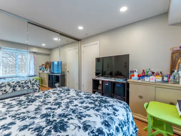 a room with a bed and a television in it