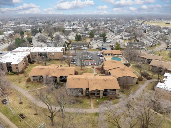 an aerial view of a yard with horses