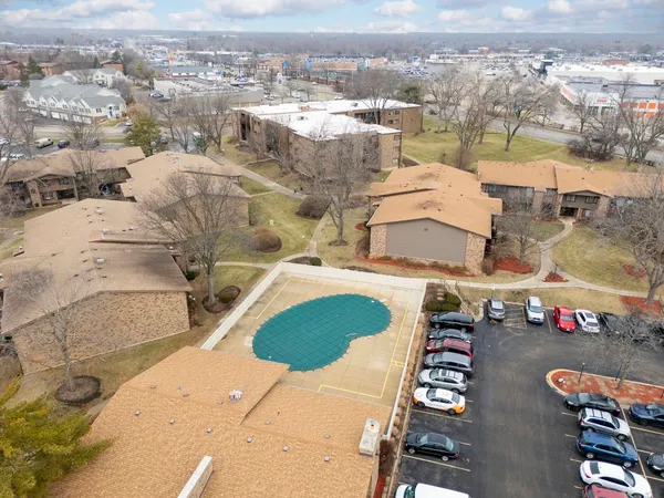 an aerial view of residential houses with outdoor space
