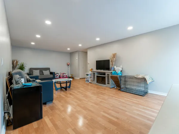 a room with furniture and a flat screen tv