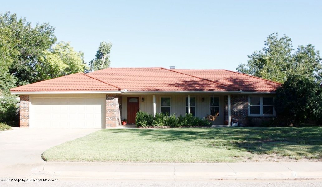 6104 Jameson Road Amarillo, TX 79106 - Photo 1 of 36 a front view of a house with garden