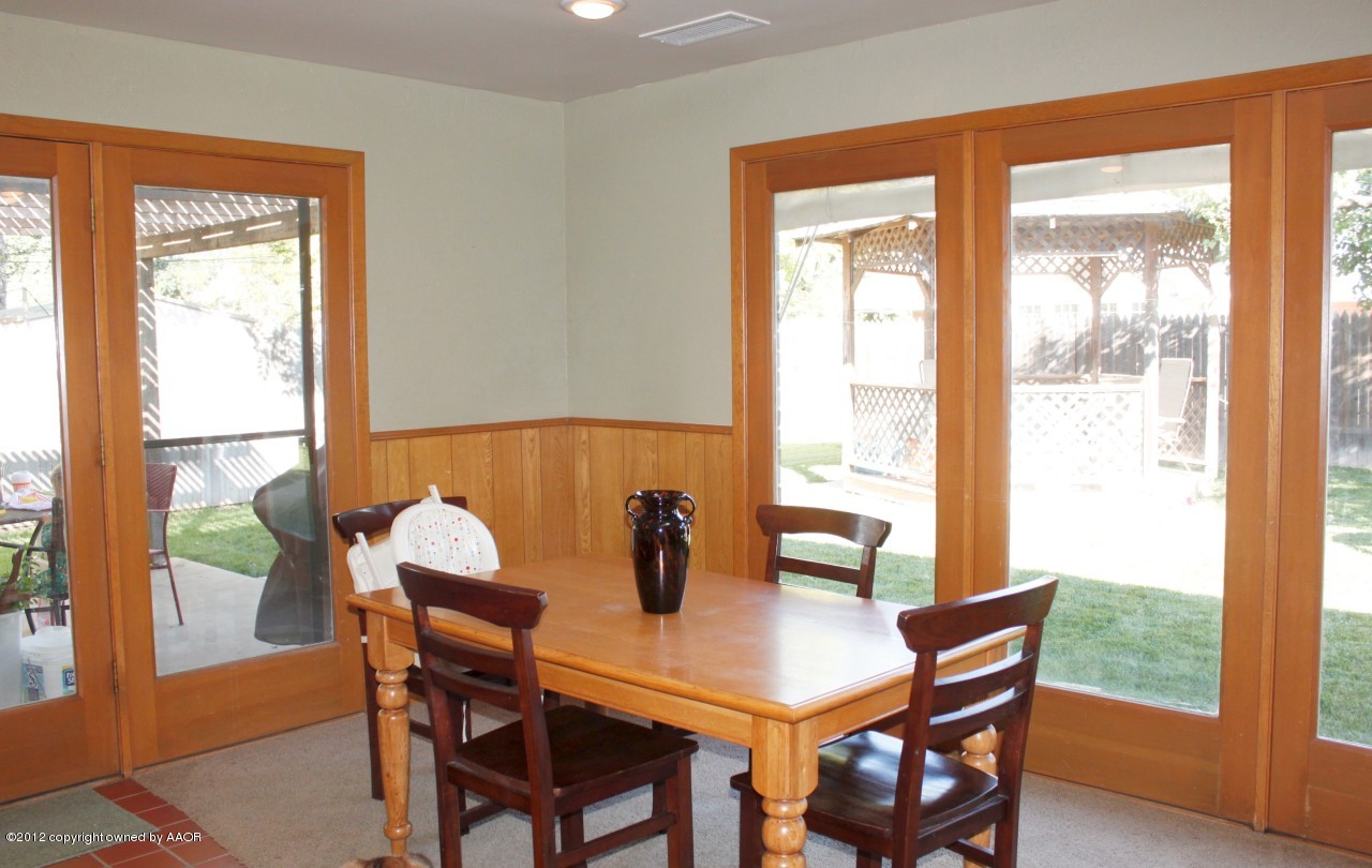 6104 Jameson Road Amarillo, TX 79106 - Photo 11 of 36 a view of a dining room with furniture and window