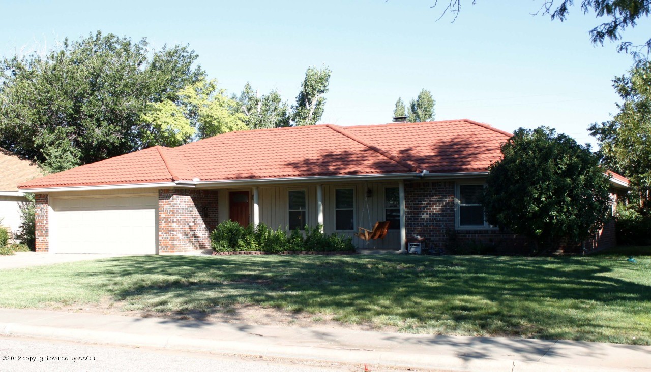 6104 Jameson Road Amarillo, TX 79106 - Photo 2 of 36 a view of a white house with a yard and potted plants