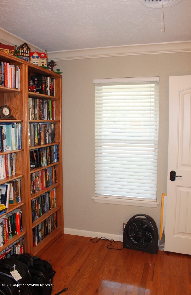 6104 Jameson Road Amarillo, TX 79106 - Photo 28 of 36 a room with a book shelf and a window