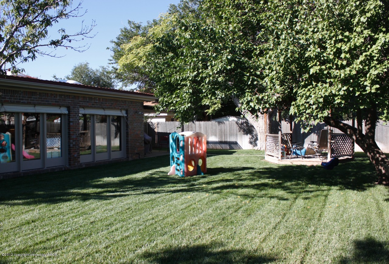 6104 Jameson Road Amarillo, TX 79106 - Photo 34 of 36 a front view of a house with a yard