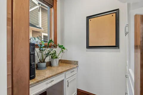 a view of a hallway with the wooden floor