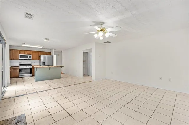 a view of a kitchen with microwave and cabinets