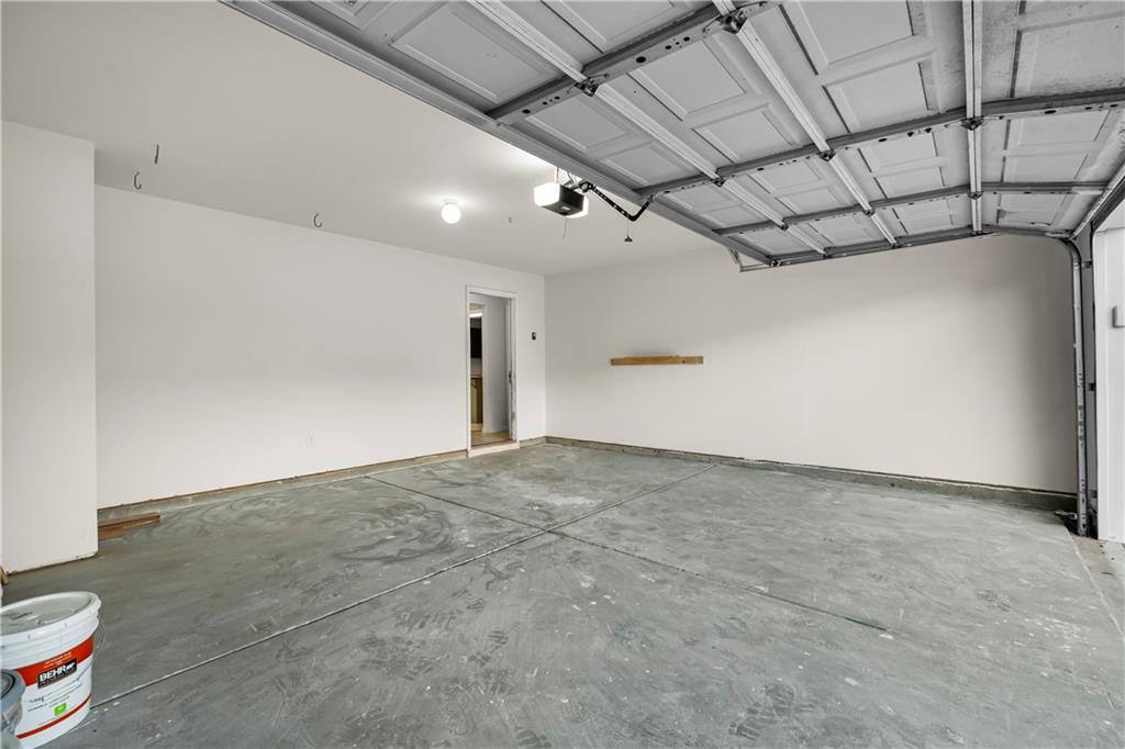 3740 Crescent Walk Lane Northeast Suwanee, GA 30024 - Photo 17 of 39 a view of a livingroom with a projector