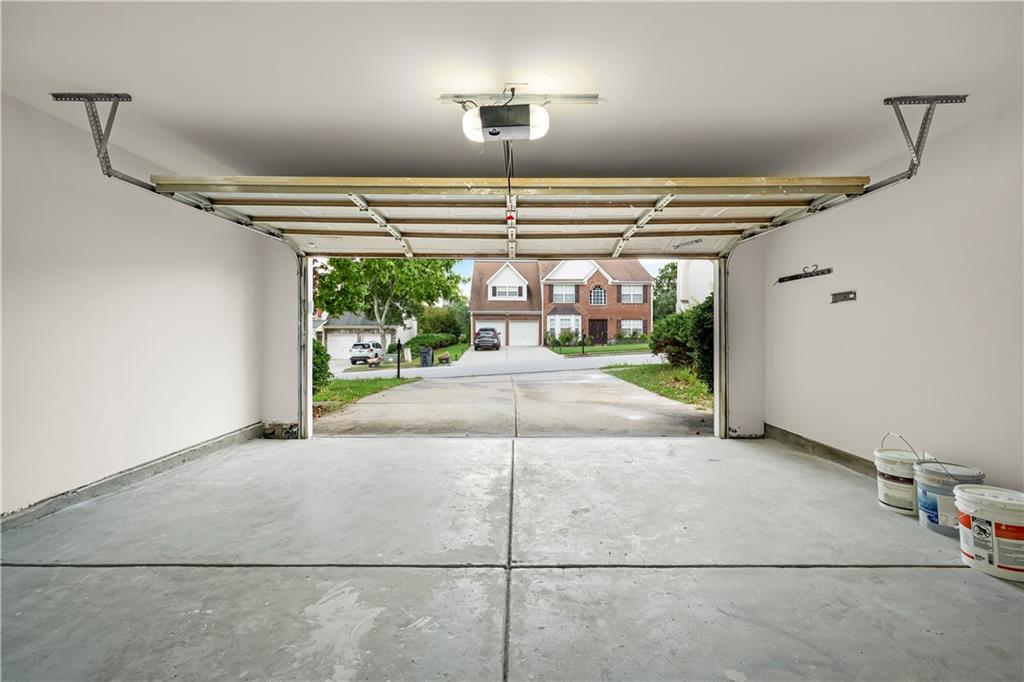 3740 Crescent Walk Lane Northeast Suwanee, GA 30024 - Photo 18 of 39 a view of a porch with a table and chairs