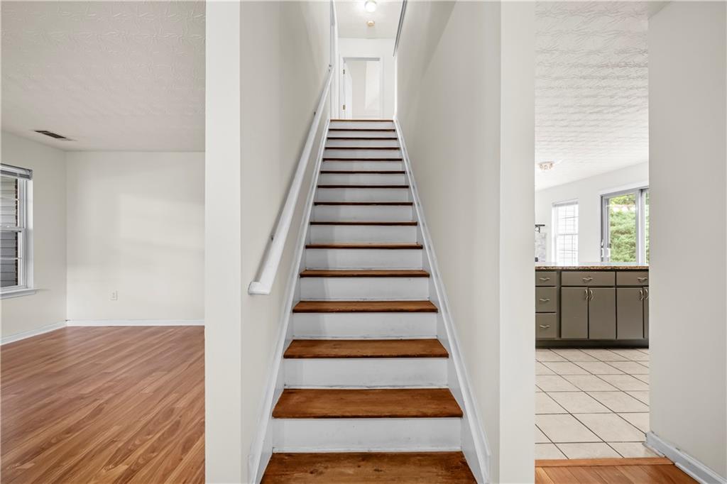 3740 Crescent Walk Lane Northeast Suwanee, GA 30024 - Photo 19 of 39 a view of entryway and hall with wooden floor