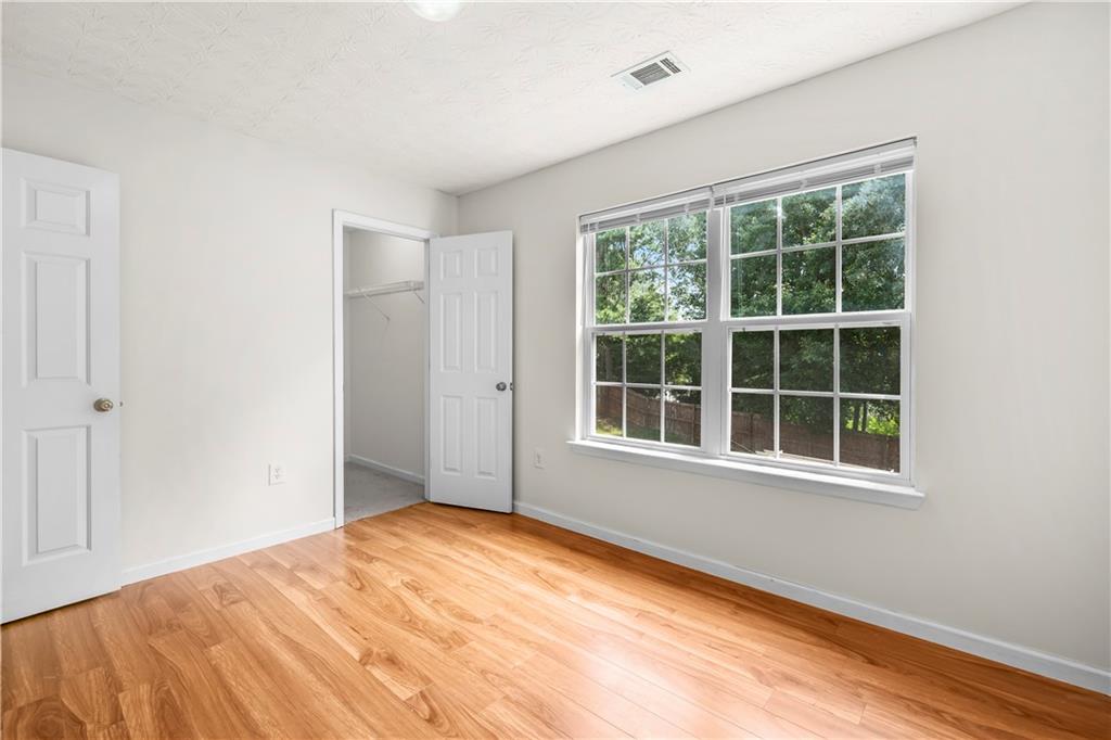 3740 Crescent Walk Lane Northeast Suwanee, GA 30024 - Photo 29 of 39 a view of an empty room with a window