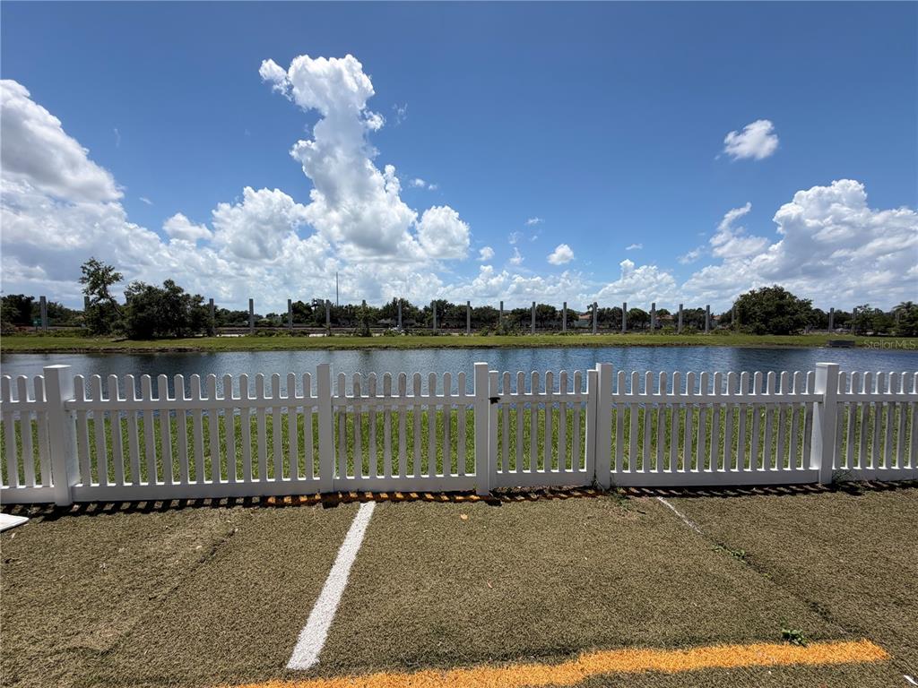 945 Tramells Trail Kissimmee, FL 34744 - Photo 36 of 36 a view of a lake with a big yard