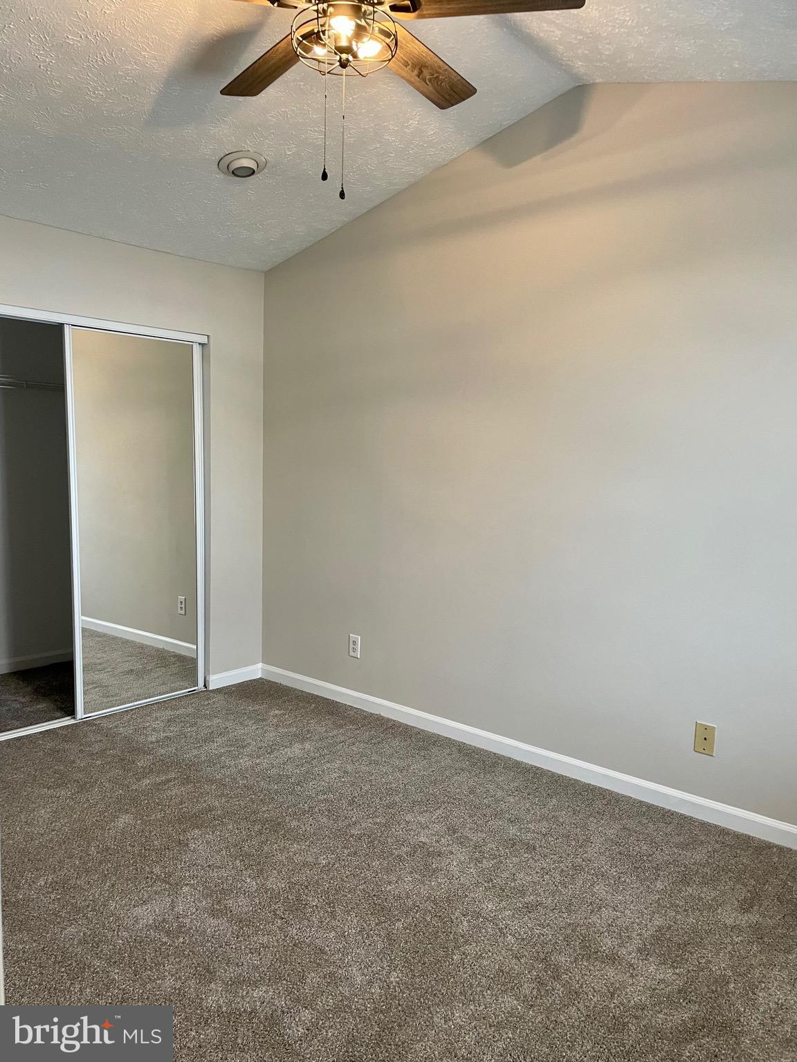 5126 Mallards Landing Drive King George, VA 22485 - Photo 16 of 19 an empty room with a ceiling fan and carpet