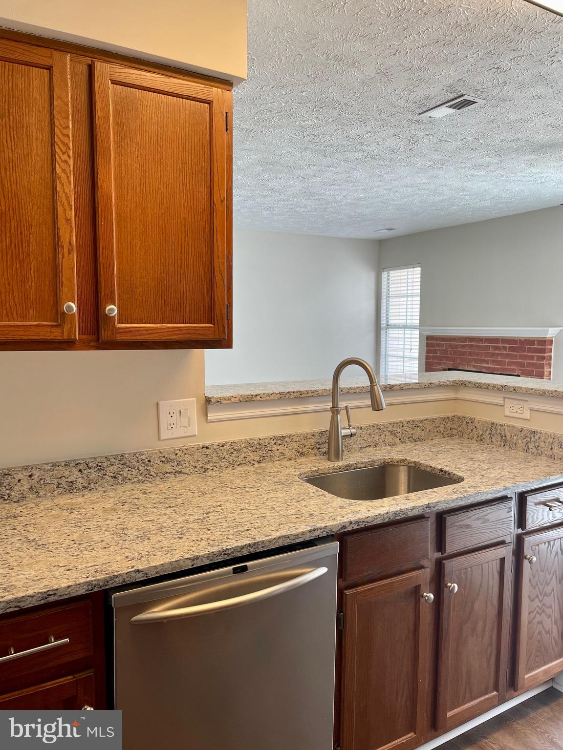 5126 Mallards Landing Drive King George, VA 22485 - Photo 3 of 19 a view with granite countertop a sink and cabinets
