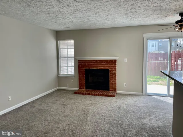 an empty room with a fireplace