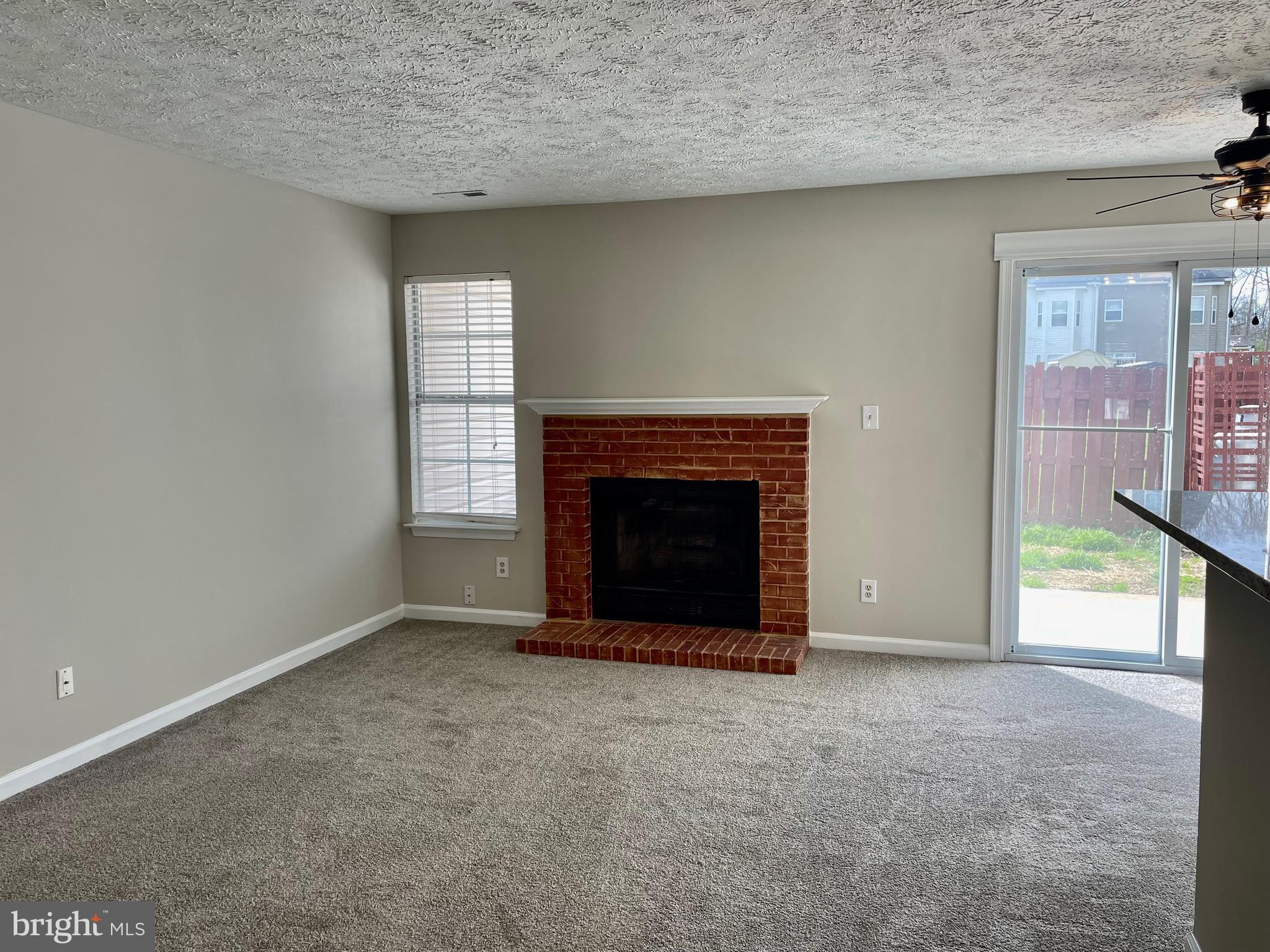 5126 Mallards Landing Drive King George, VA 22485 - Photo 8 of 19 an empty room with a fireplace