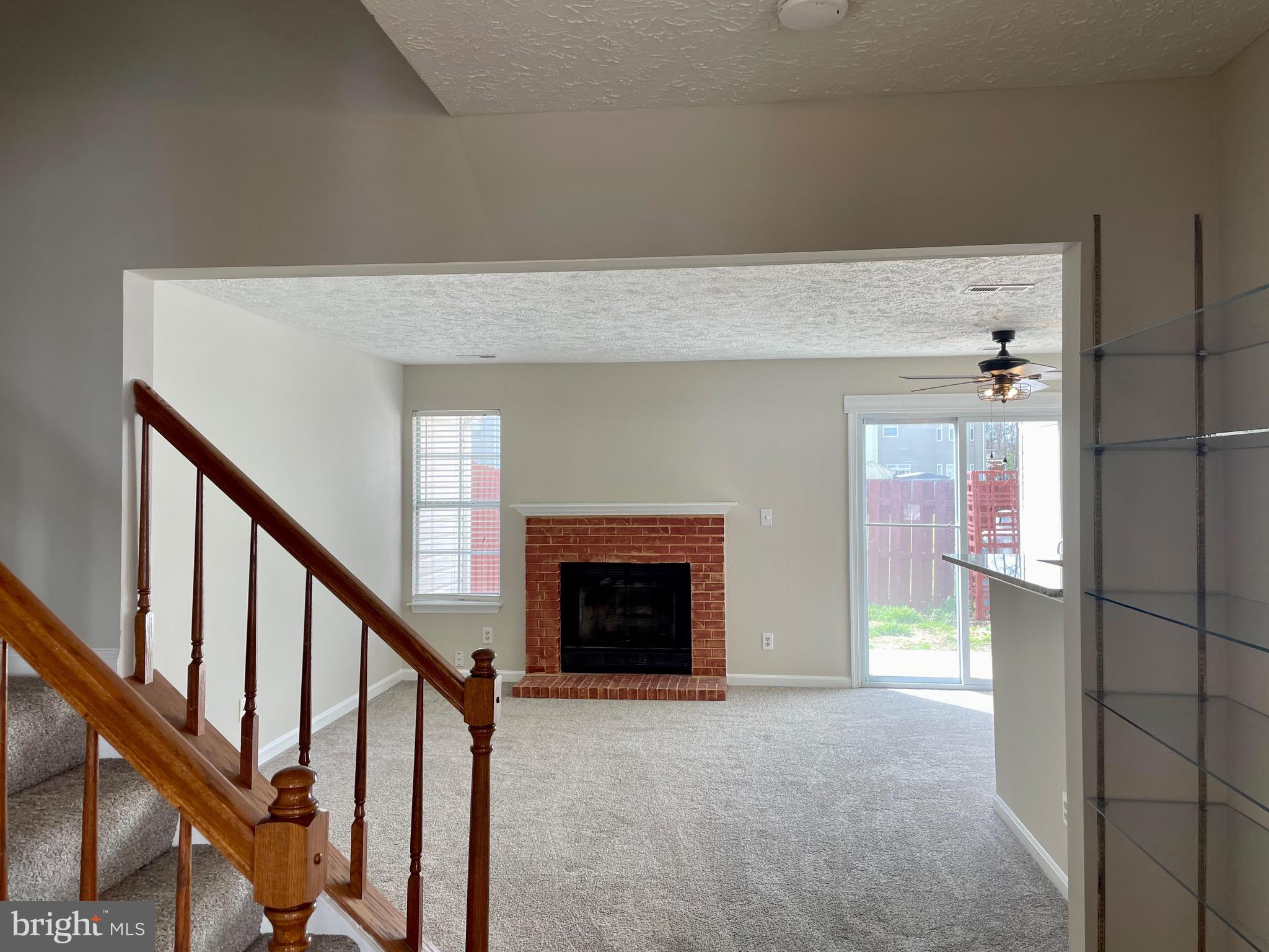 5126 Mallards Landing Drive King George, VA 22485 - Photo 9 of 19 a view of an empty room with fireplace and stairs