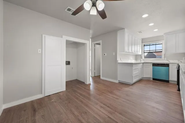 a view of kitchen with sink microwave and stove