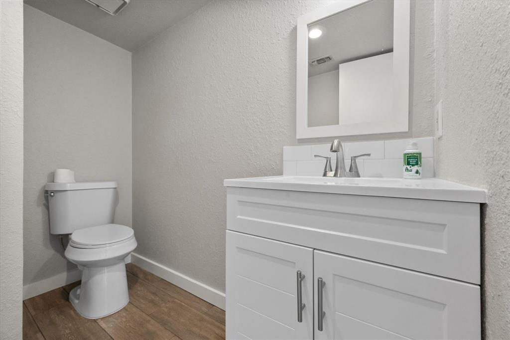 443 County Road 3799 Springtown, TX 76082 - Photo 22 of 33 a bathroom with a sink toilet and mirror