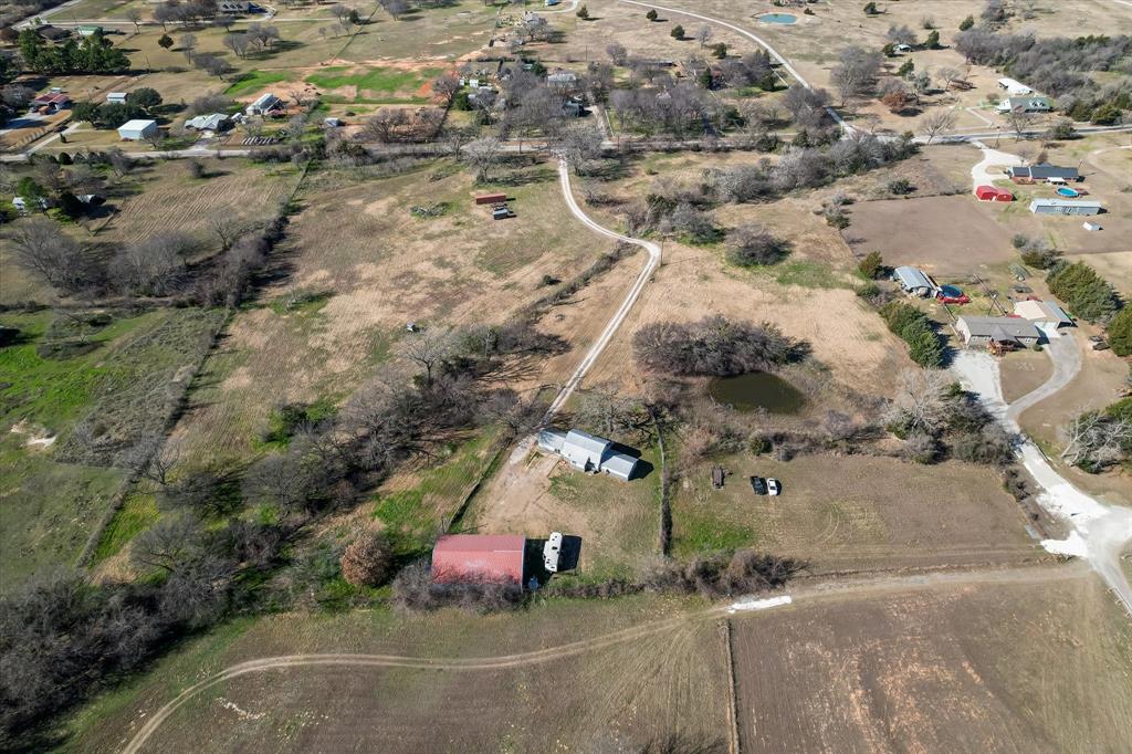 443 County Road 3799 Springtown, TX 76082 - Photo 4 of 33 an aerial view of a house with a yard
