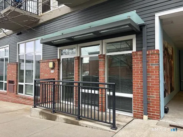 a view of a brick house with a large window