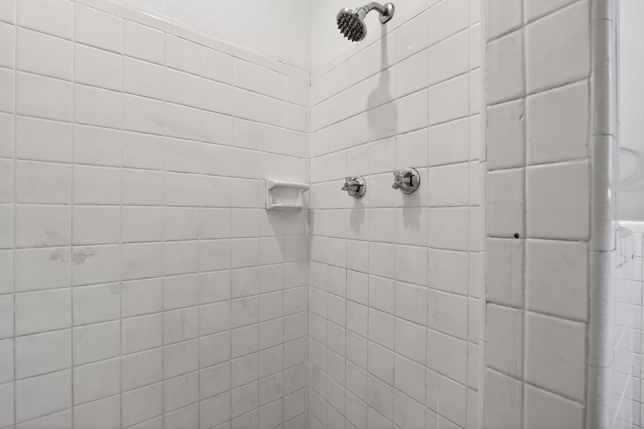 3445 Powers Road Memphis, TN 38128 - Photo 28 of 35 Shower with white square wall tiles and chrome fixtures