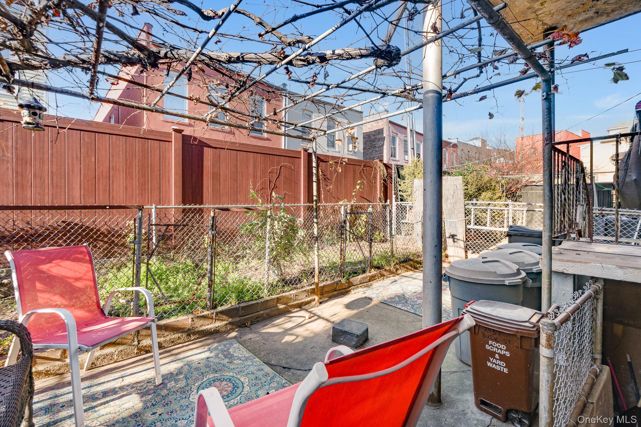 2437 Buck Street Bronx, NY 10461 - Photo 18 of 38 a backyard of a house with seating space