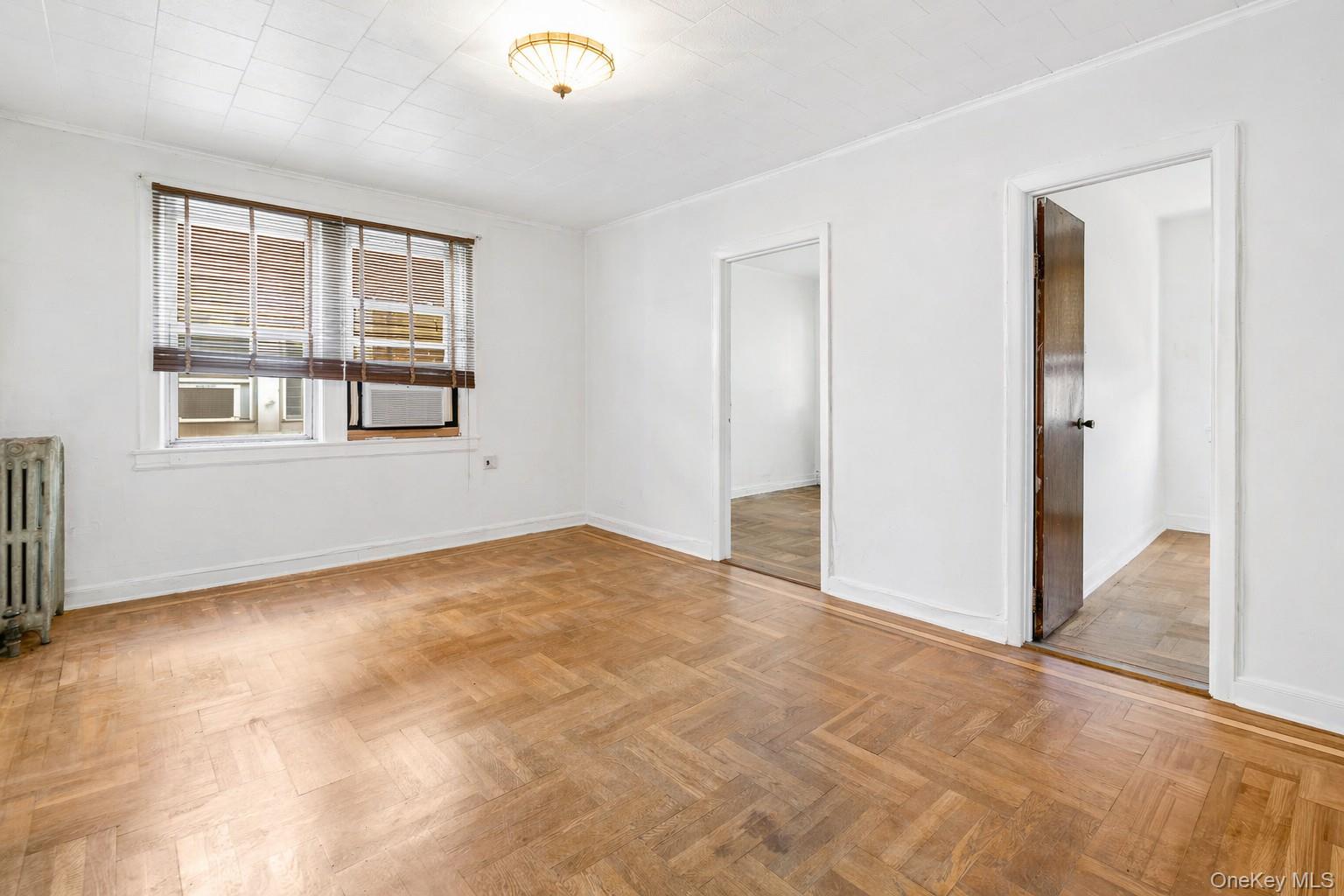 2437 Buck Street Bronx, NY 10461 - Photo 19 of 38 an empty room with windows