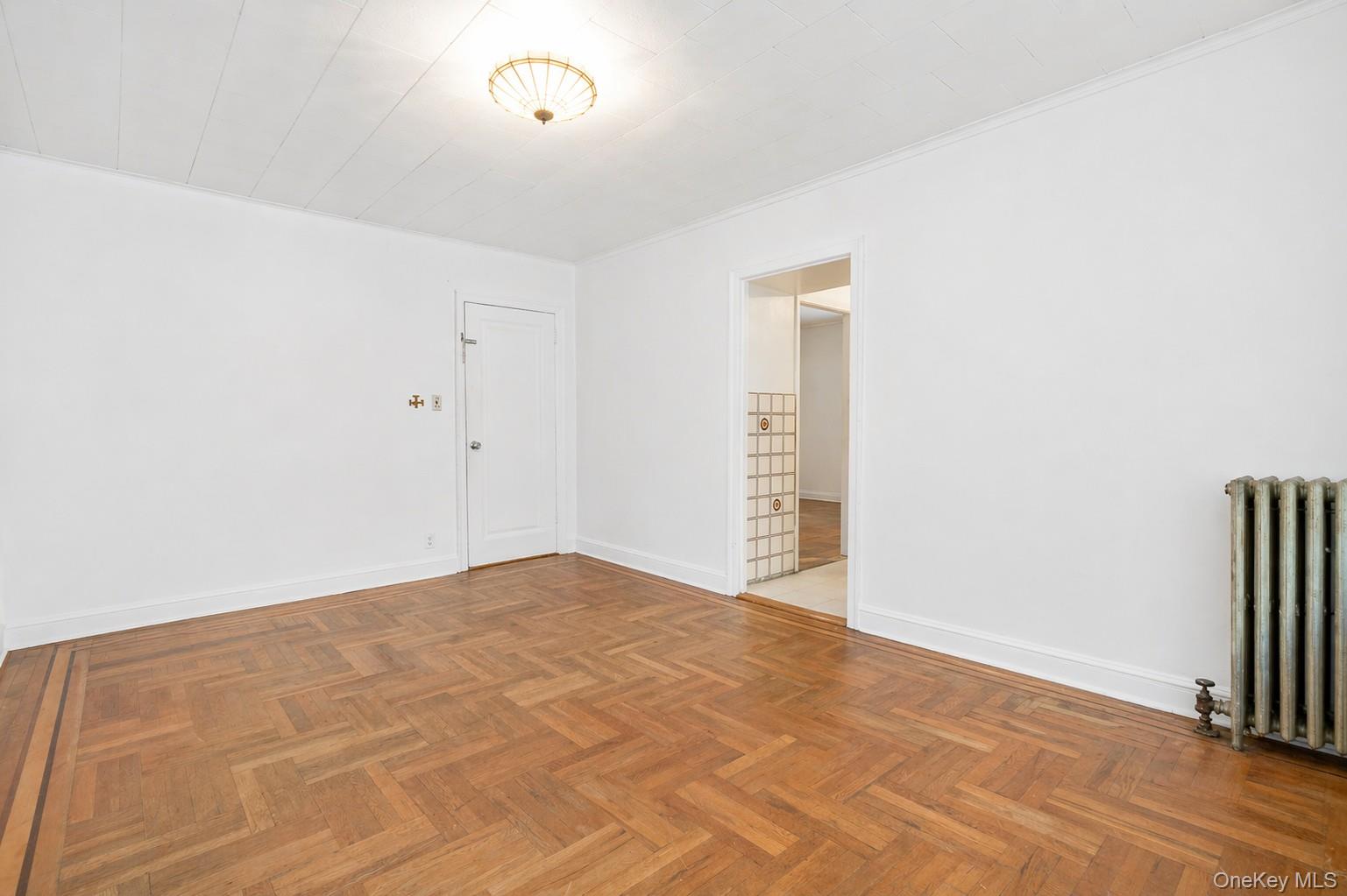2437 Buck Street Bronx, NY 10461 - Photo 21 of 38 a view of empty room with wooden floor