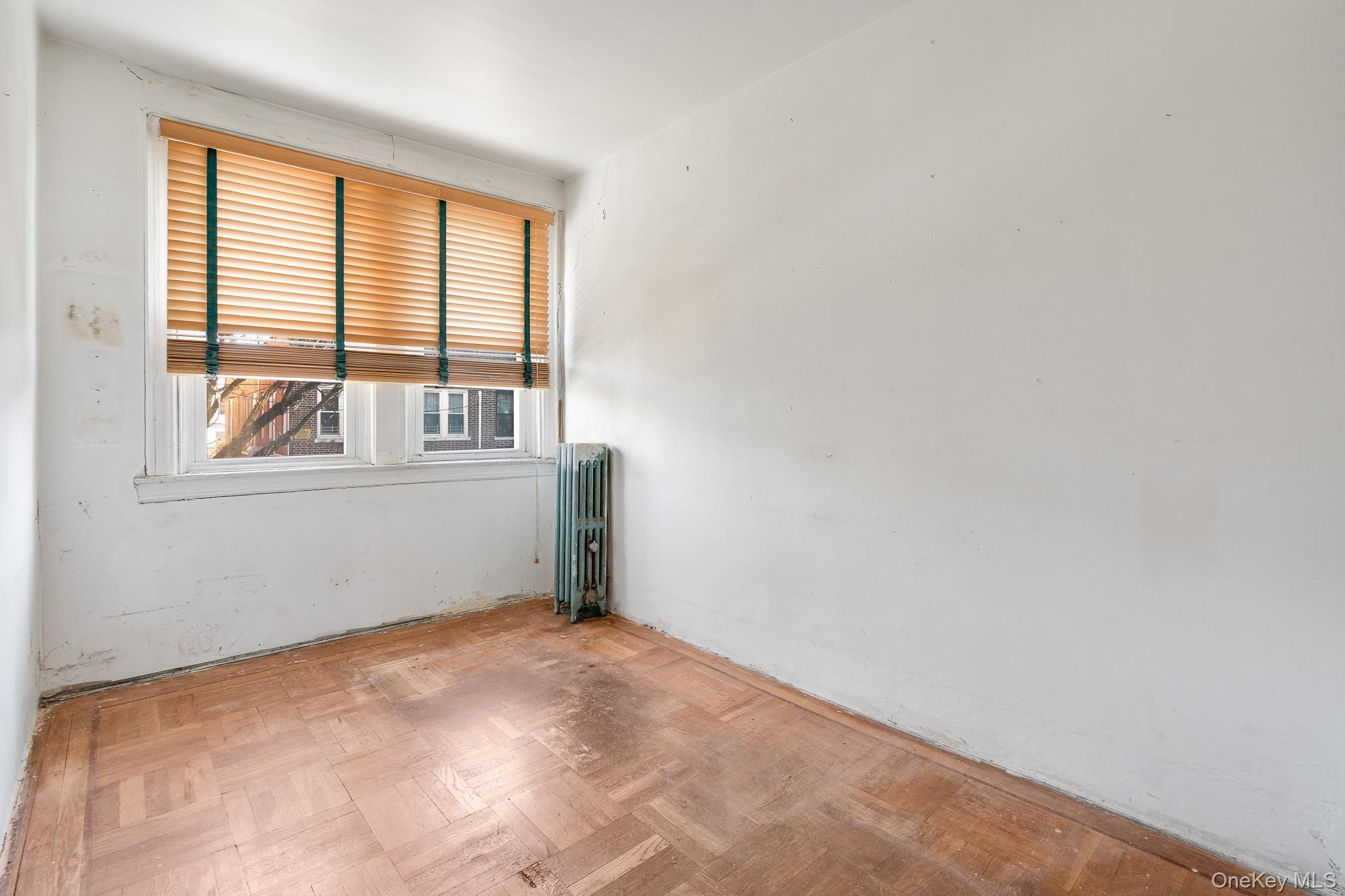 2437 Buck Street Bronx, NY 10461 - Photo 22 of 38 an empty room with a window