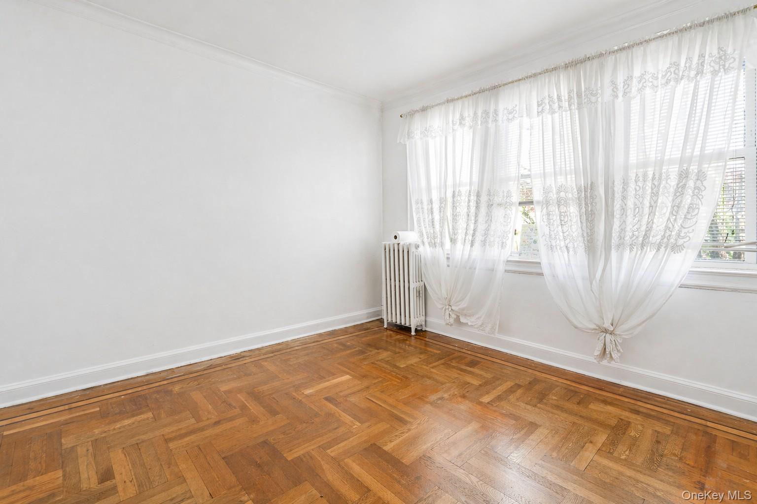 2437 Buck Street Bronx, NY 10461 - Photo 24 of 38 an empty room with a empty space and a window