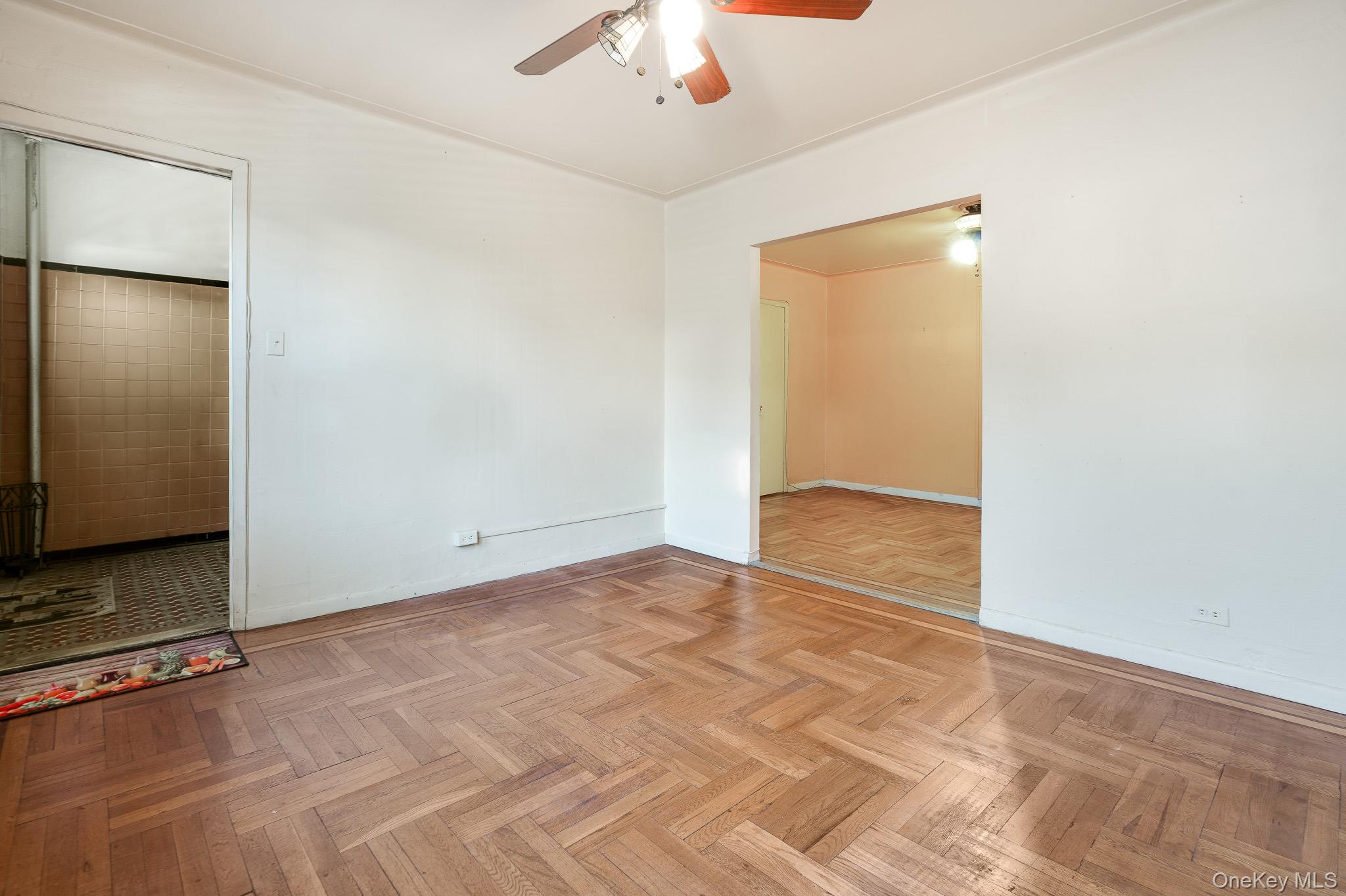 2437 Buck Street Bronx, NY 10461 - Photo 7 of 38 a view of an empty room with a ceiling fan