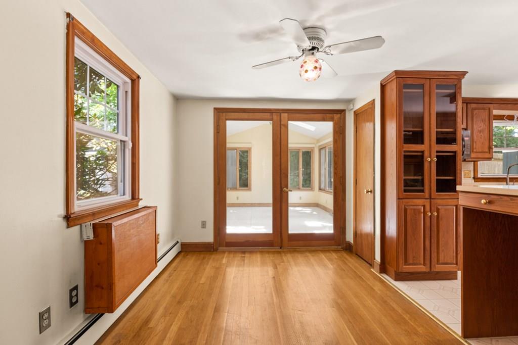 19 Ronald Road Arlington, MA 02474 - Photo 15 of 28 an empty room with wooden floor and windows