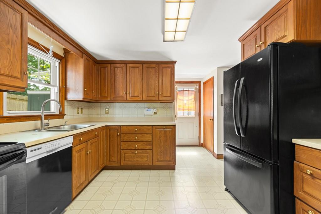 19 Ronald Road Arlington, MA 02474 - Photo 8 of 28 a kitchen with stainless steel appliances granite countertop a refrigerator and a sink