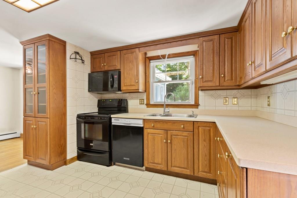 19 Ronald Road Arlington, MA 02474 - Photo 10 of 28 a kitchen with a sink stove and cabinets