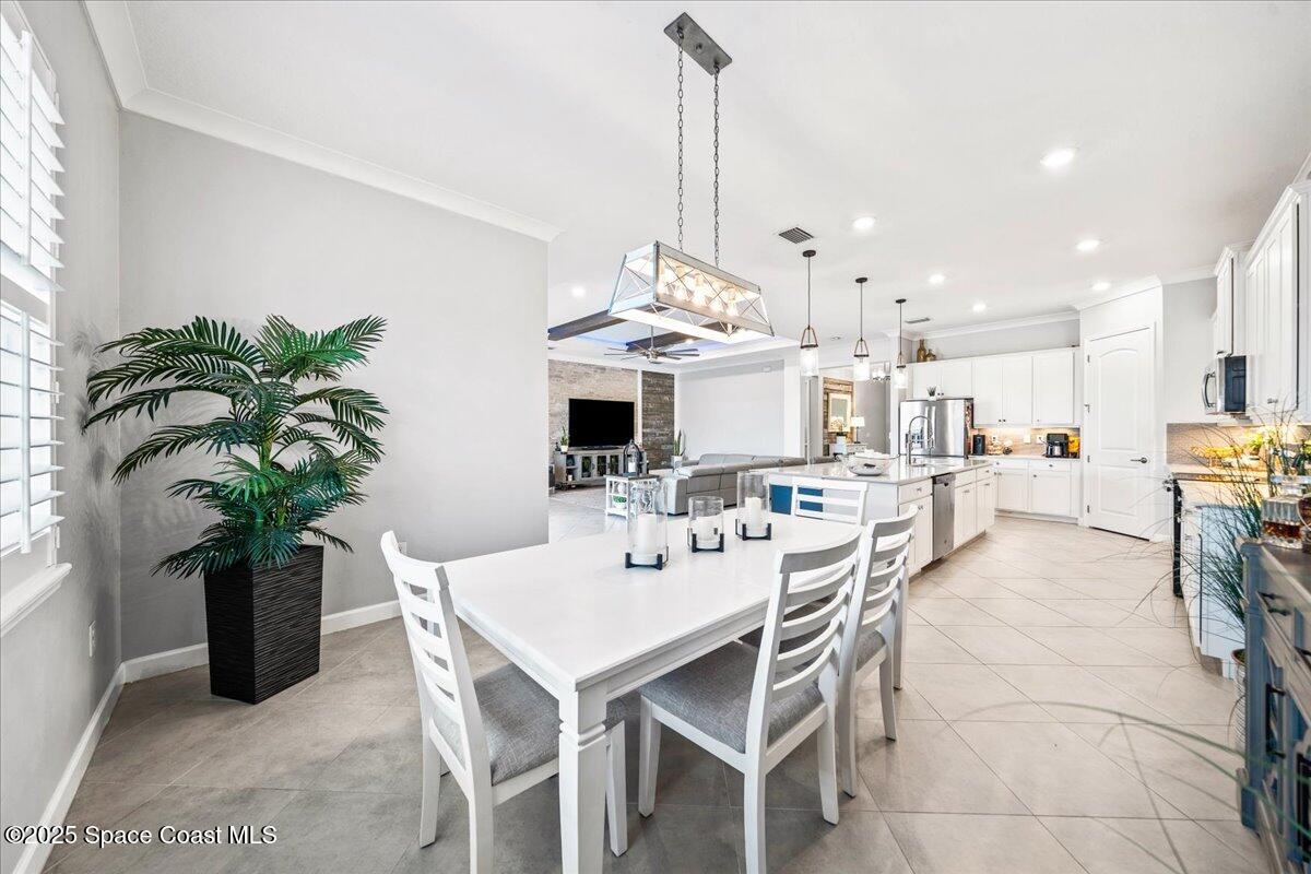 2190 Caravan Place Melbourne, FL 32940 - Photo 21 of 46 a view of a dining room with furniture