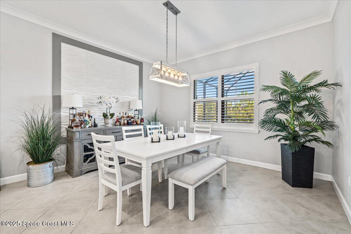 2190 Caravan Place Melbourne, FL 32940 - Photo 22 of 46 a dining room with furniture and window