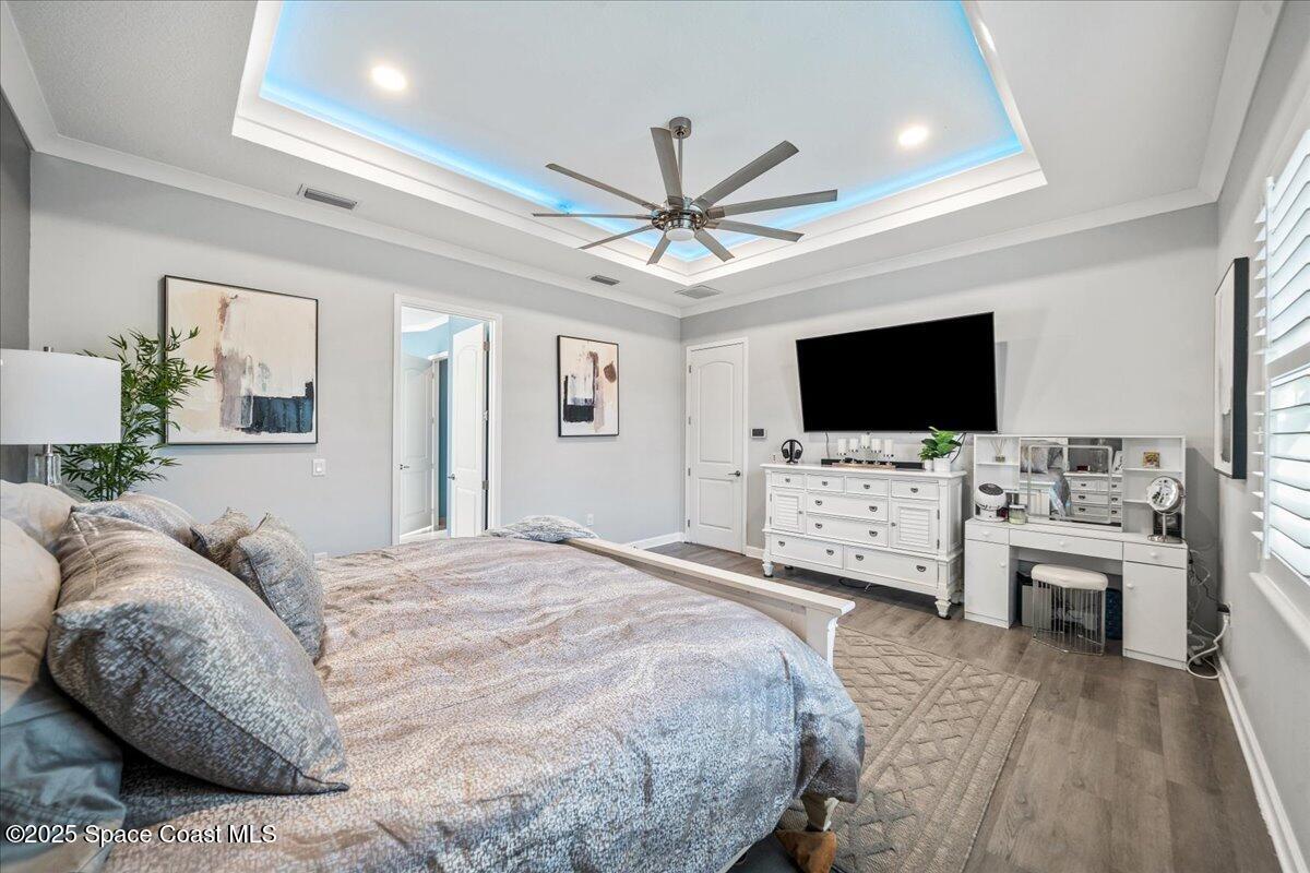 2190 Caravan Place Melbourne, FL 32940 - Photo 25 of 46 a bedroom with a bed tv and a window