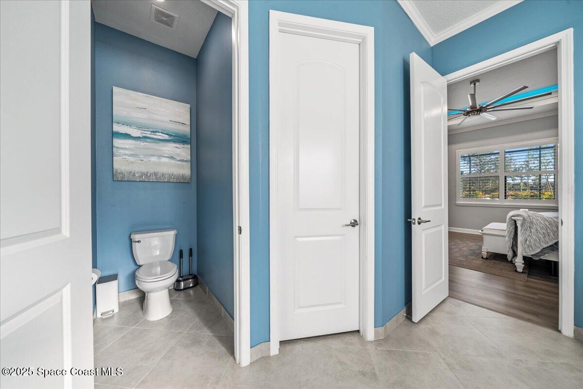 2190 Caravan Place Melbourne, FL 32940 - Photo 28 of 46 a bathroom with a toilet