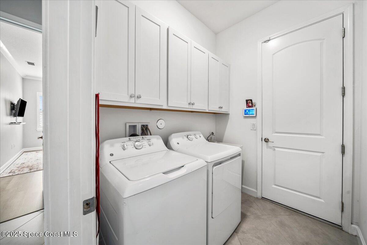 2190 Caravan Place Melbourne, FL 32940 - Photo 30 of 46 a utility room with dryer and washer